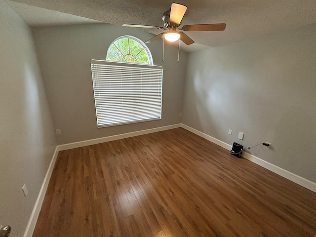 unfurnished room featuring a textured ceiling, hardwood / wood-style flooring, and ceiling fan