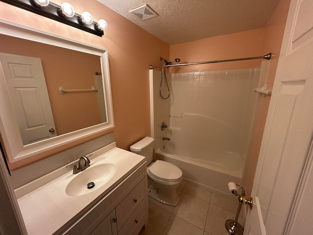 full bathroom featuring tile patterned flooring,  shower combination, a textured ceiling, toilet, and vanity