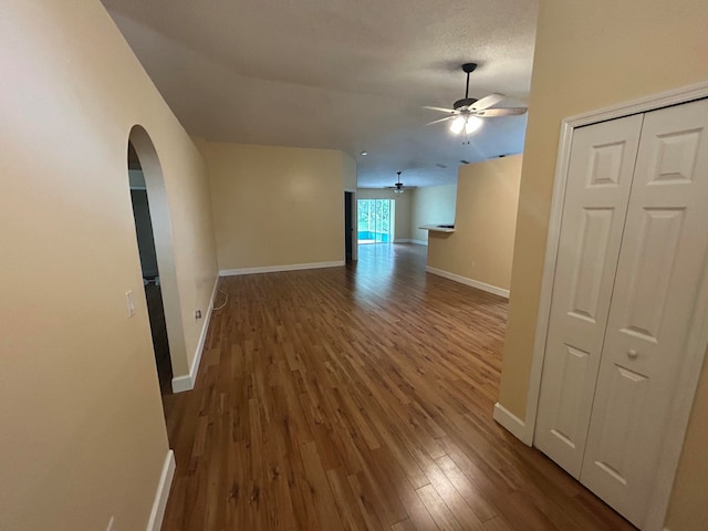 interior space with a textured ceiling and hardwood / wood-style flooring