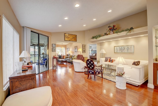 living room featuring a textured ceiling and light hardwood / wood-style flooring