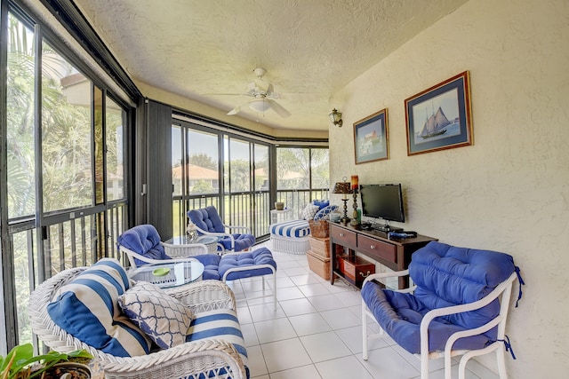 sunroom / solarium featuring ceiling fan