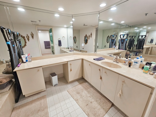 bathroom with tile patterned floors and vanity