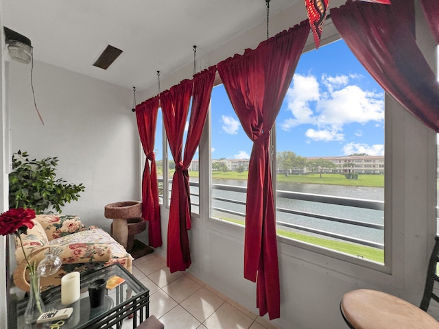 interior space featuring a wealth of natural light and a water view