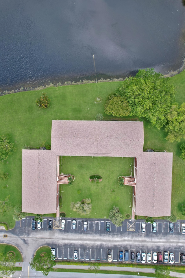 birds eye view of property featuring a water view