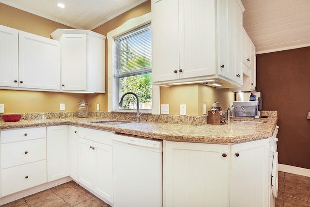 kitchen with dishwasher, light stone counters, white cabinetry, and sink