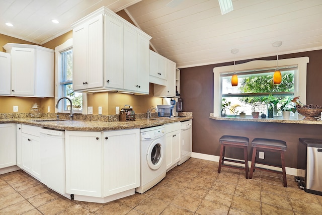 kitchen featuring white cabinets, white dishwasher, and vaulted ceiling