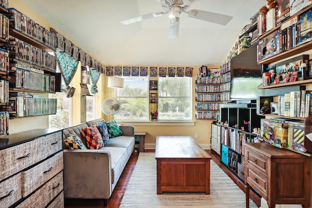 living room with ceiling fan and hardwood / wood-style flooring