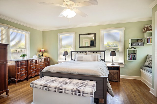 bedroom with dark hardwood / wood-style flooring, multiple windows, ornamental molding, and ceiling fan