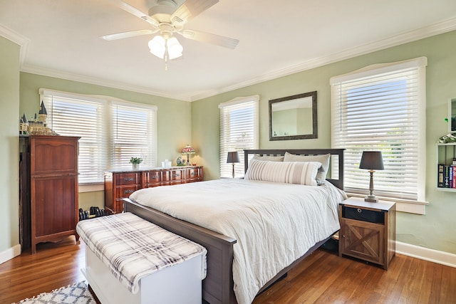 bedroom featuring multiple windows, ceiling fan, and dark hardwood / wood-style floors