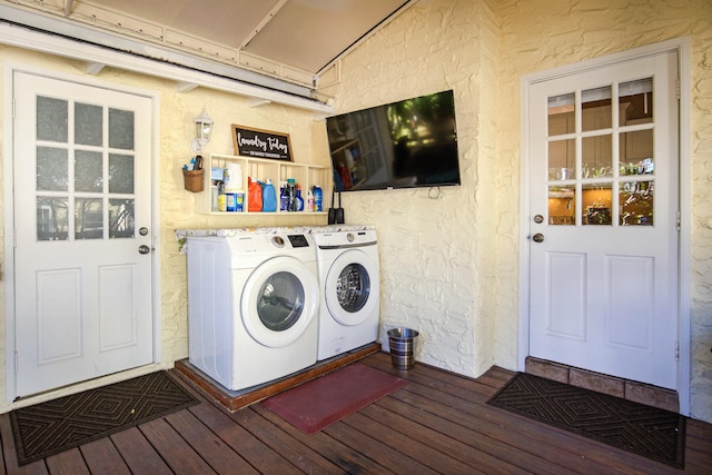 laundry area featuring independent washer and dryer and dark wood-type flooring