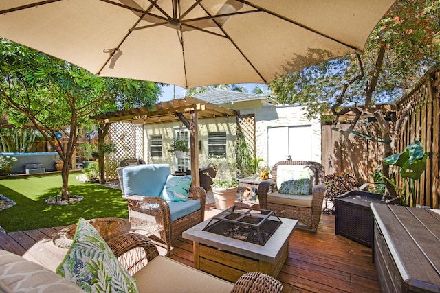 deck with a pergola and an outdoor living space with a fire pit