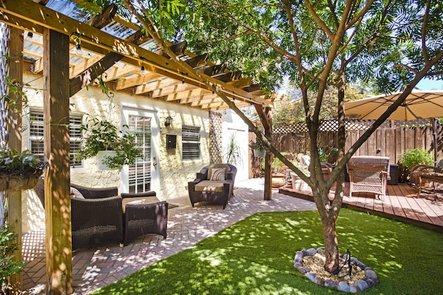 view of patio featuring a pergola and a wooden deck