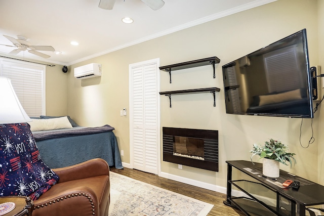 living room with dark hardwood / wood-style floors, ceiling fan, crown molding, and a wall mounted AC