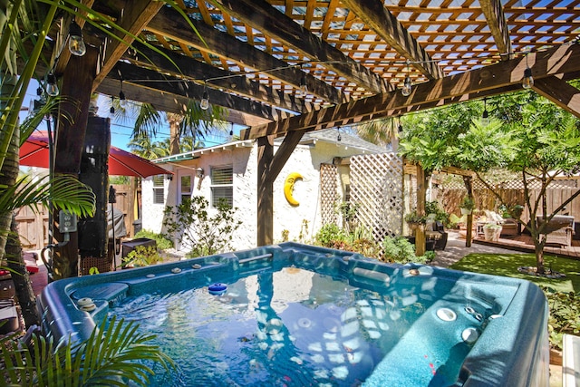 view of swimming pool featuring a pergola and a hot tub