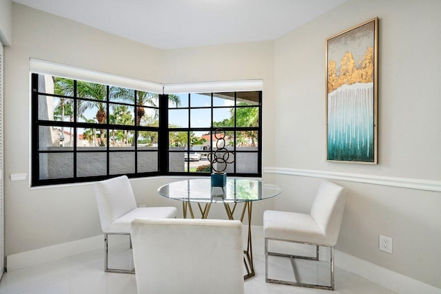 dining space with a healthy amount of sunlight and light tile patterned flooring