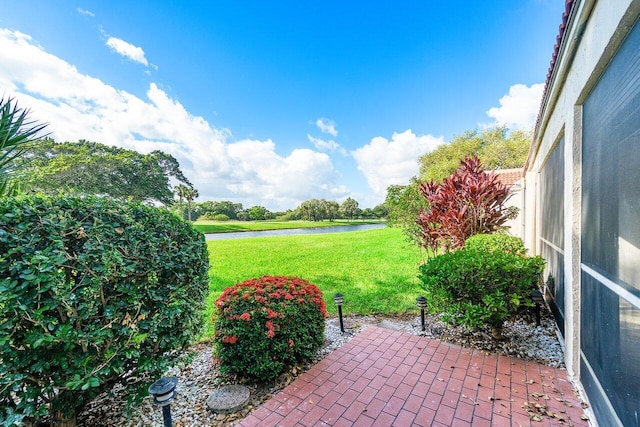 view of patio / terrace with a water view