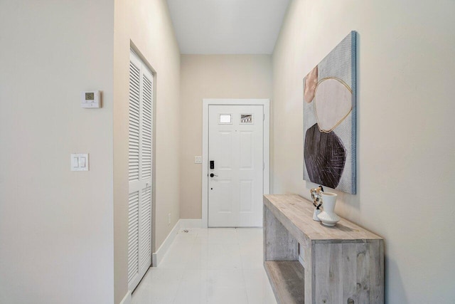 entryway with light tile patterned floors