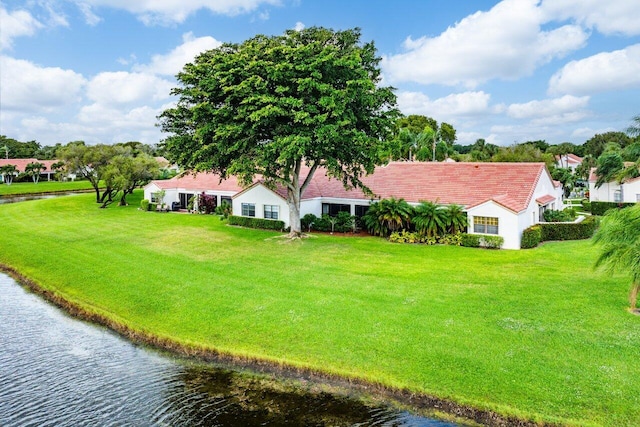 birds eye view of property with a water view