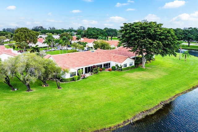 drone / aerial view with a water view