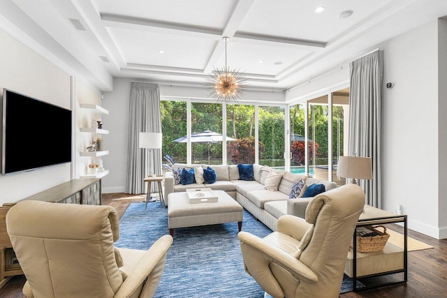 living room with dark hardwood / wood-style floors, a healthy amount of sunlight, a chandelier, and coffered ceiling