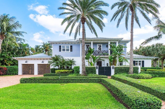 view of front of house with a garage and a front yard