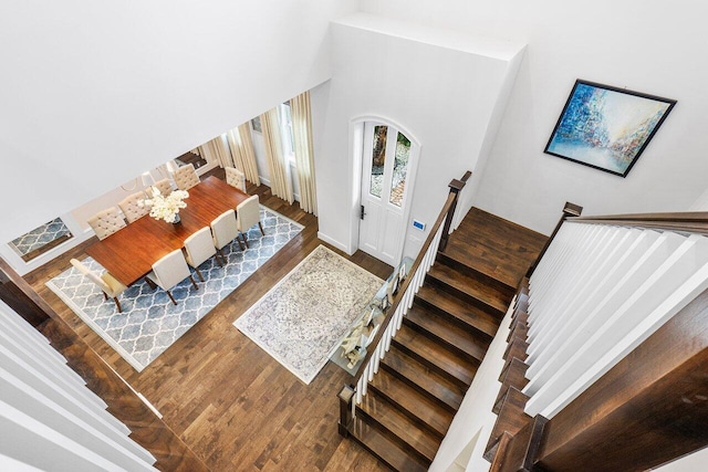 entryway with dark hardwood / wood-style flooring