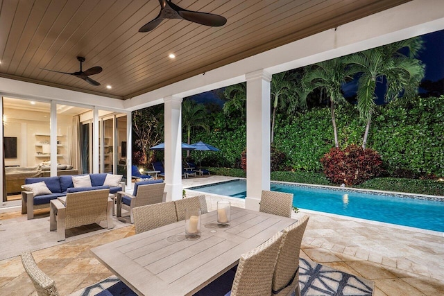 view of pool featuring ceiling fan, an outdoor living space, and a patio