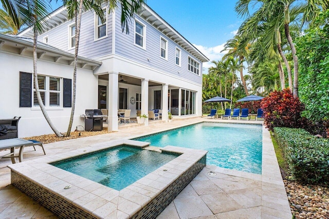 view of swimming pool with a patio area and a grill