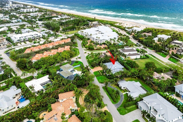 bird's eye view with a beach view and a water view