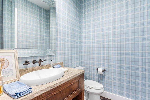 bathroom with vanity and toilet