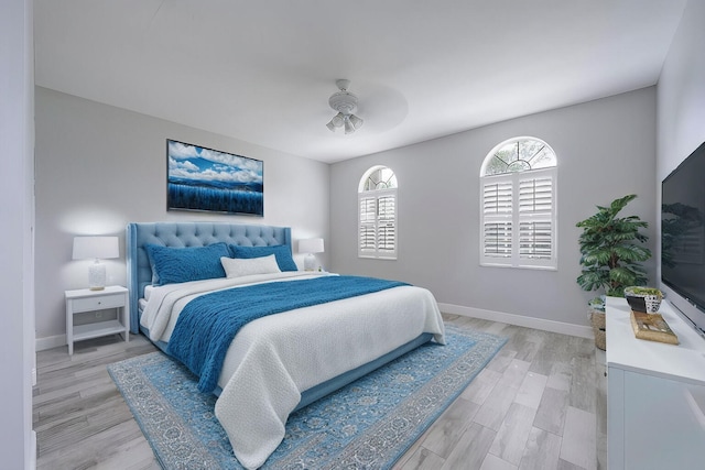 bedroom with ceiling fan and light wood-type flooring