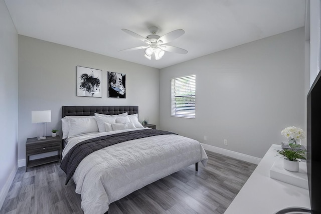 bedroom featuring ceiling fan and dark wood-type flooring