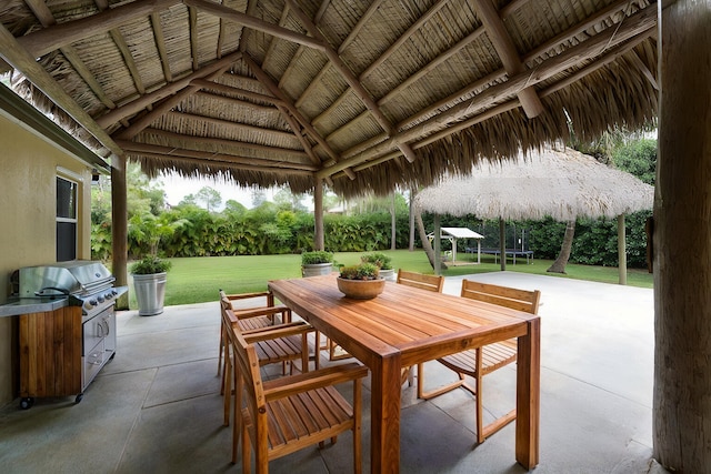 view of patio with a gazebo, grilling area, and a trampoline