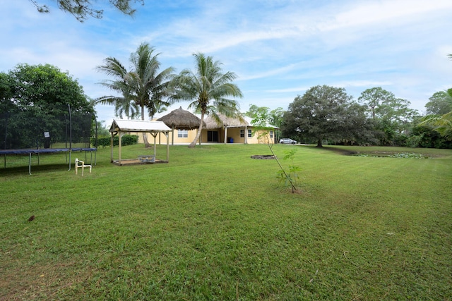 view of yard with a gazebo and a trampoline