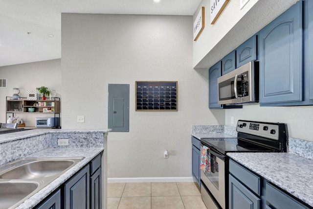 kitchen with appliances with stainless steel finishes, sink, blue cabinetry, light tile patterned floors, and electric panel