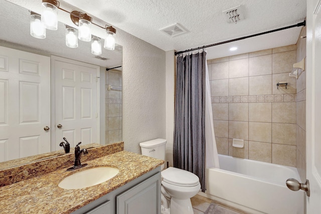 full bathroom featuring vanity, shower / tub combo, a textured ceiling, and toilet