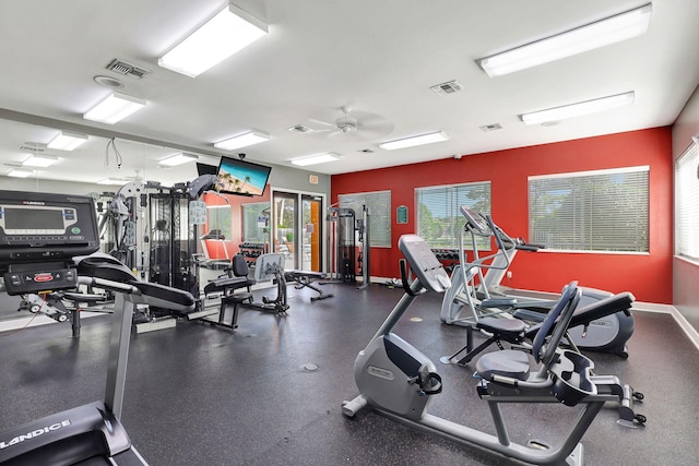 exercise room with ceiling fan