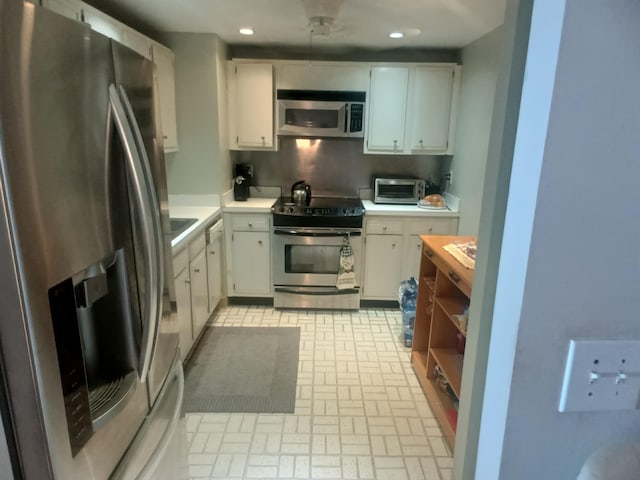 kitchen with white cabinets and stainless steel appliances