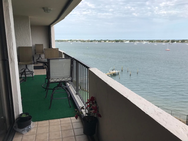 balcony featuring a water view