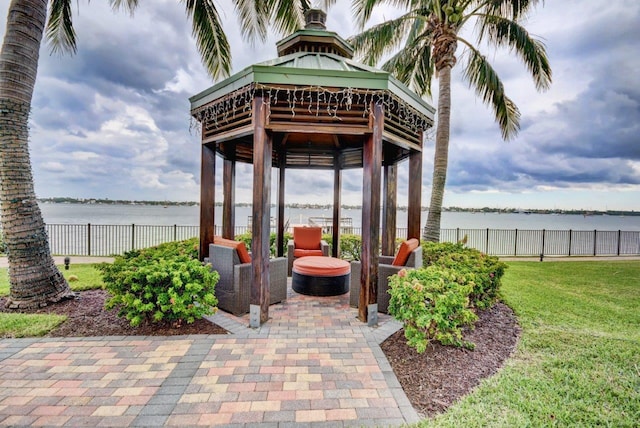 view of patio / terrace with a gazebo and a water view