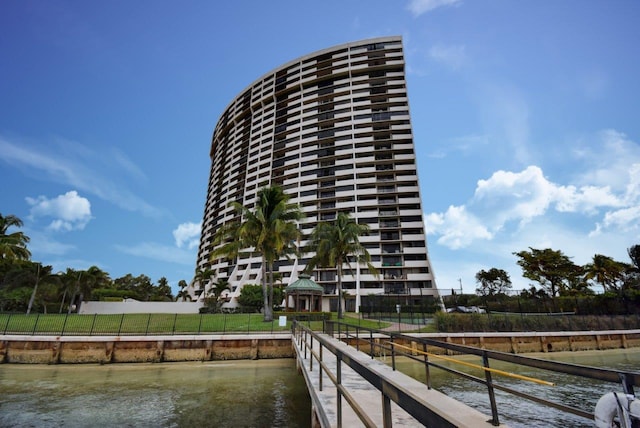 view of dock featuring a gazebo and a water view