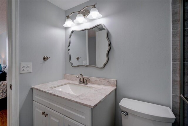 bathroom with vanity and toilet