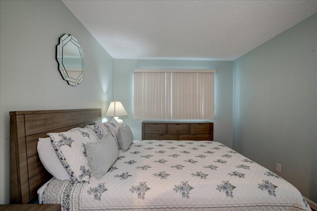 bedroom featuring a textured ceiling