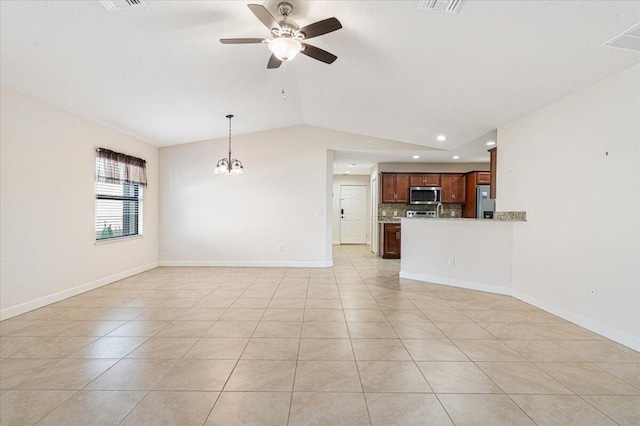 unfurnished living room with light tile patterned floors, ceiling fan with notable chandelier, and vaulted ceiling