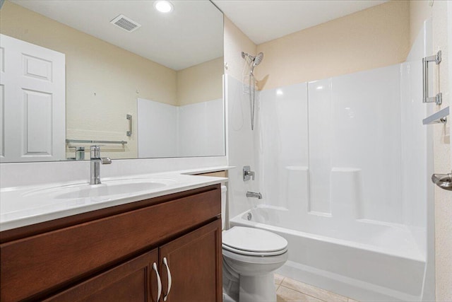 full bathroom with toilet, vanity, tile patterned floors, and tub / shower combination