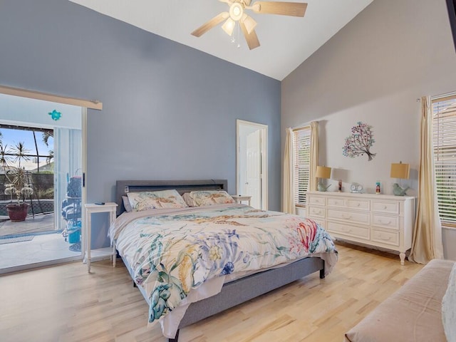 bedroom featuring ceiling fan, light hardwood / wood-style floors, access to exterior, and high vaulted ceiling