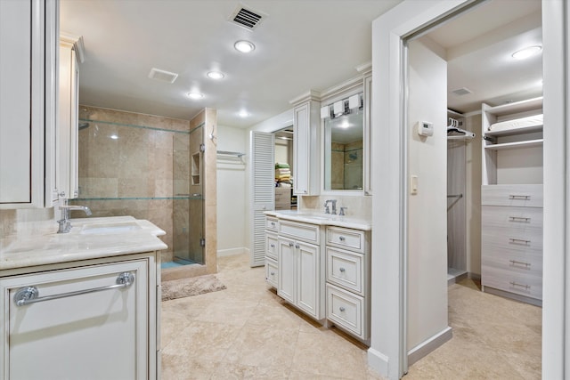 bathroom featuring walk in shower, vanity, and backsplash