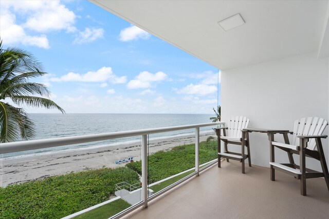 aerial view featuring a water view and a view of the beach