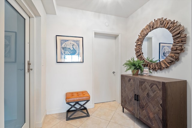 hall with light tile patterned flooring