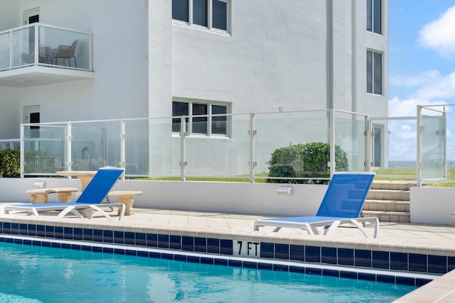 view of swimming pool featuring a patio